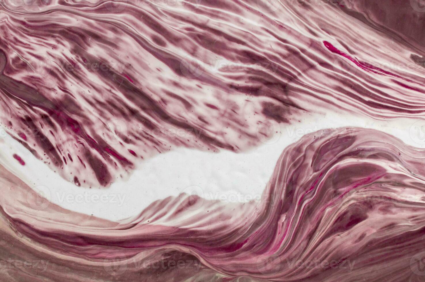 Abstract created using the technique of liquid acrylic. Macro photography of the smallest details of a picture. The picture shows how overflows of shades and colors of paint resemble space motifs. photo