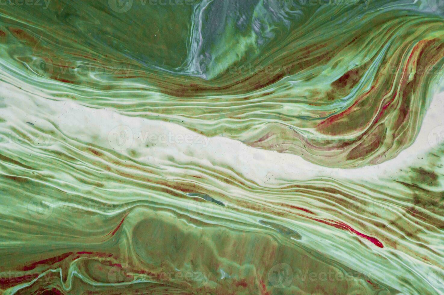 Abstract created using the technique of liquid acrylic. Macro photography of the smallest details of a picture. The picture shows how overflows of shades and colors of paint resemble space motifs. photo