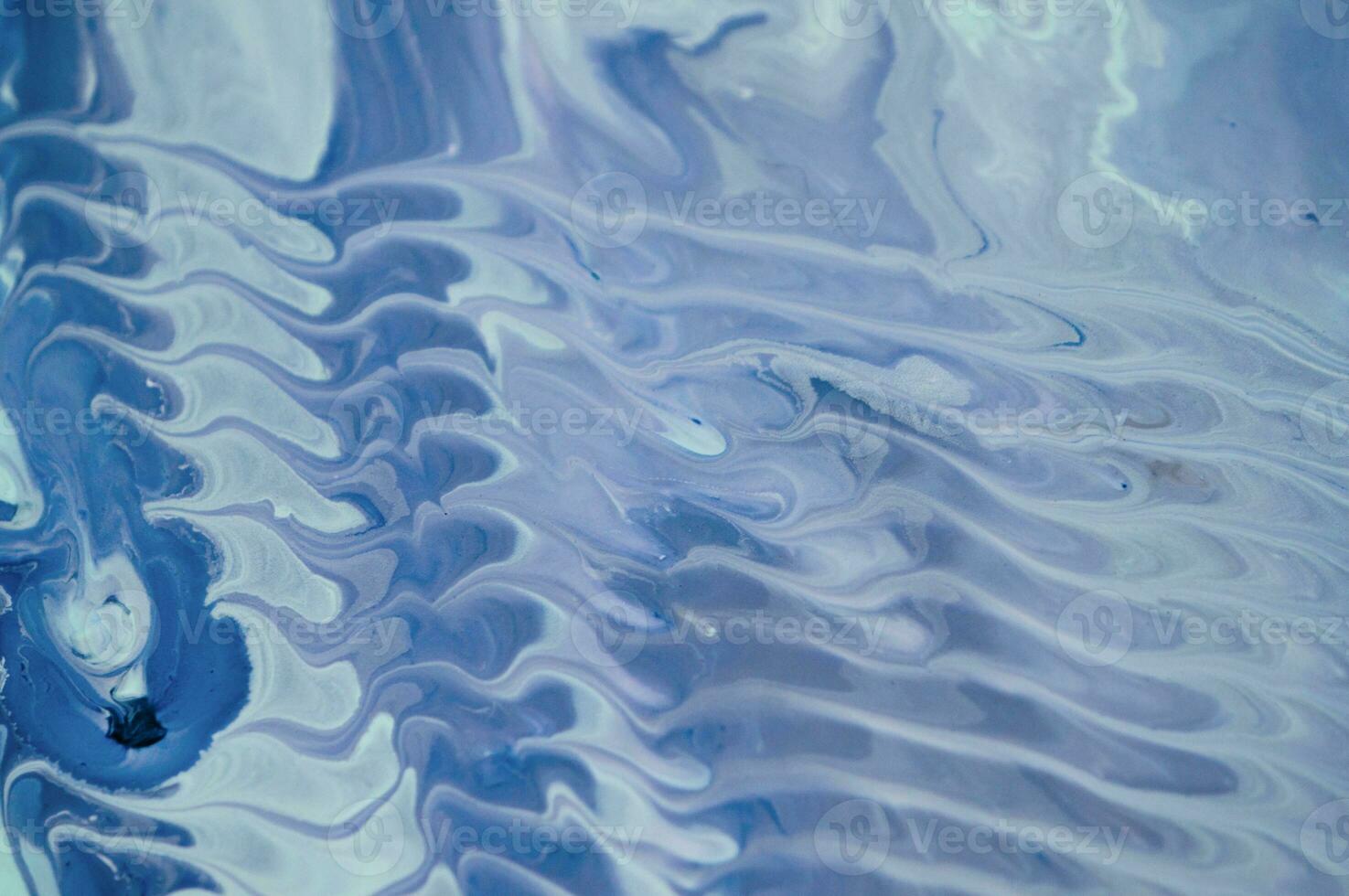 Abstract fluid acrylic painting. Marbled blue abstract background. Liquid marble pattern. Hand painted background with mixed liquid red, blue and green paints. Modern art. photo