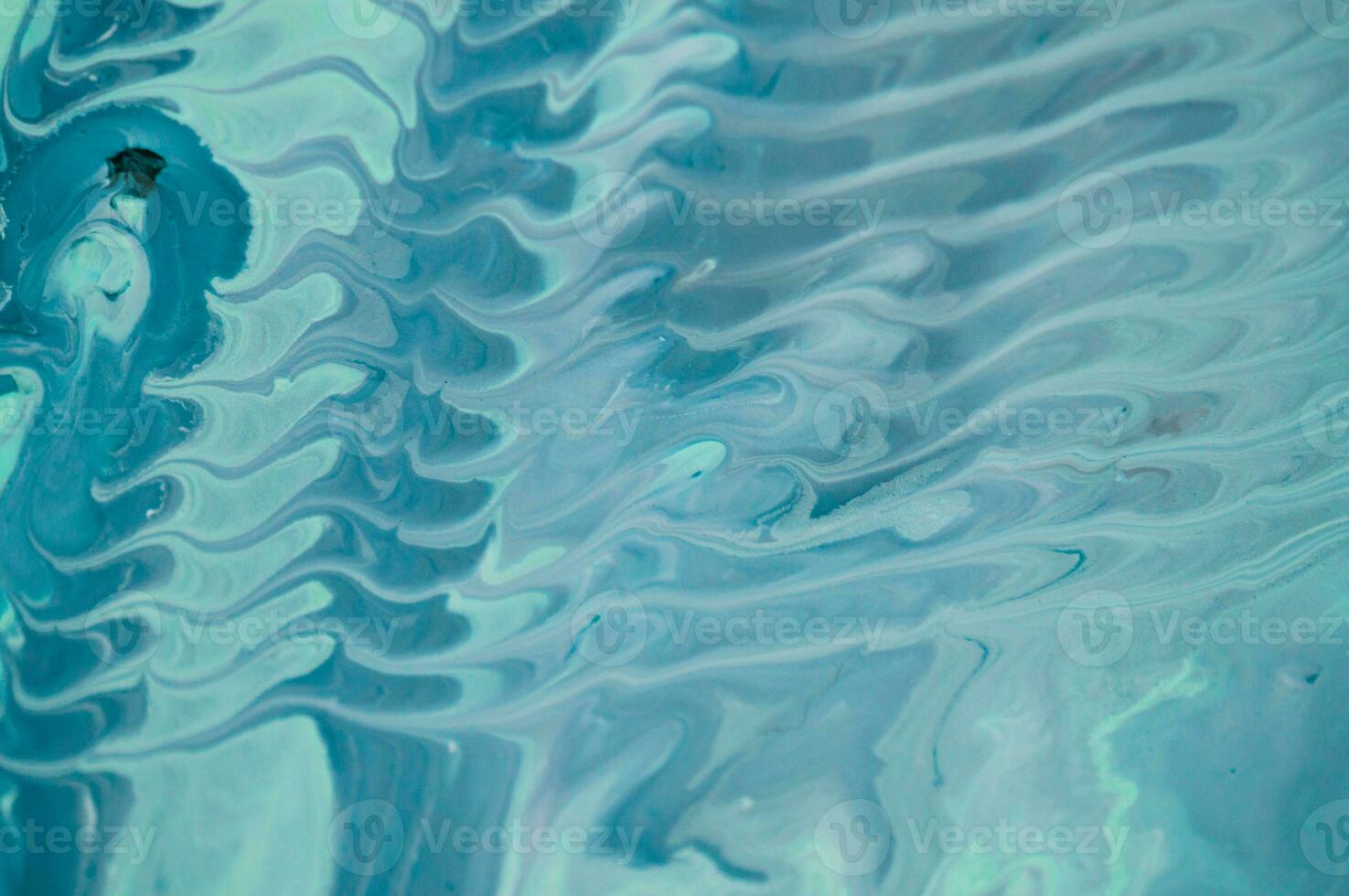 Abstract fluid acrylic painting. Marbled blue abstract background. Liquid marble pattern. Hand painted background with mixed liquid red, blue and green paints. Modern art. photo