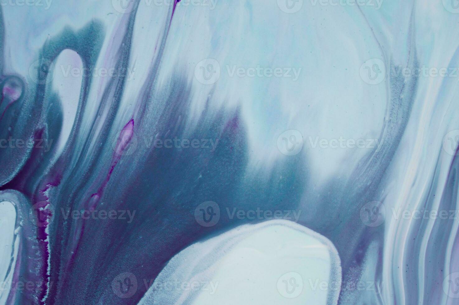 Abstract created using the technique of liquid acrylic. Macro photography of the smallest details of a panting. The panting shows how overflows of shades and colors of paint resemble space motifs. photo