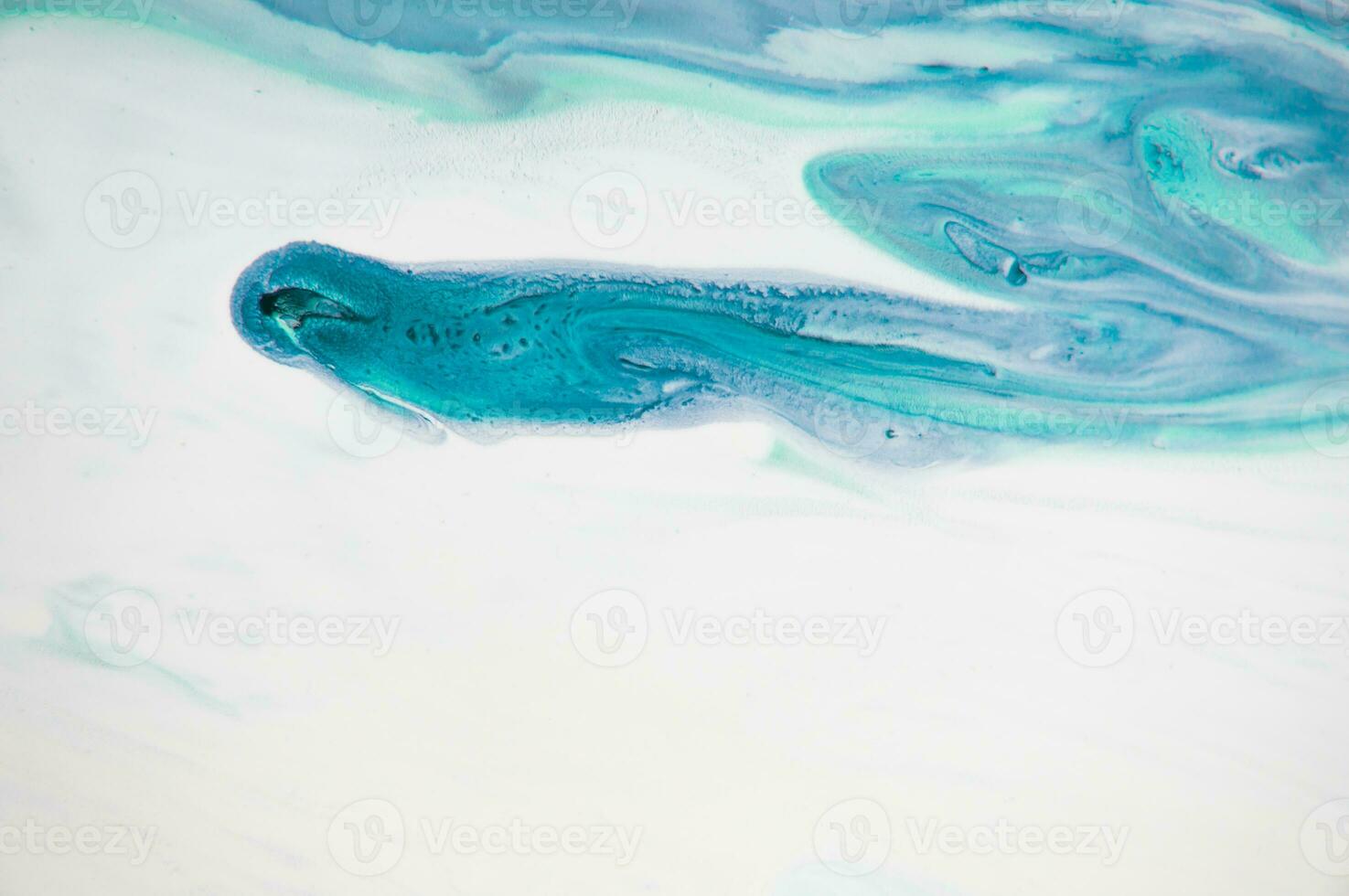 Abstract created using the technique of liquid acrylic. Macro photography of the smallest details of a panting. The panting shows how overflows of shades and colors of paint resemble space motifs. photo