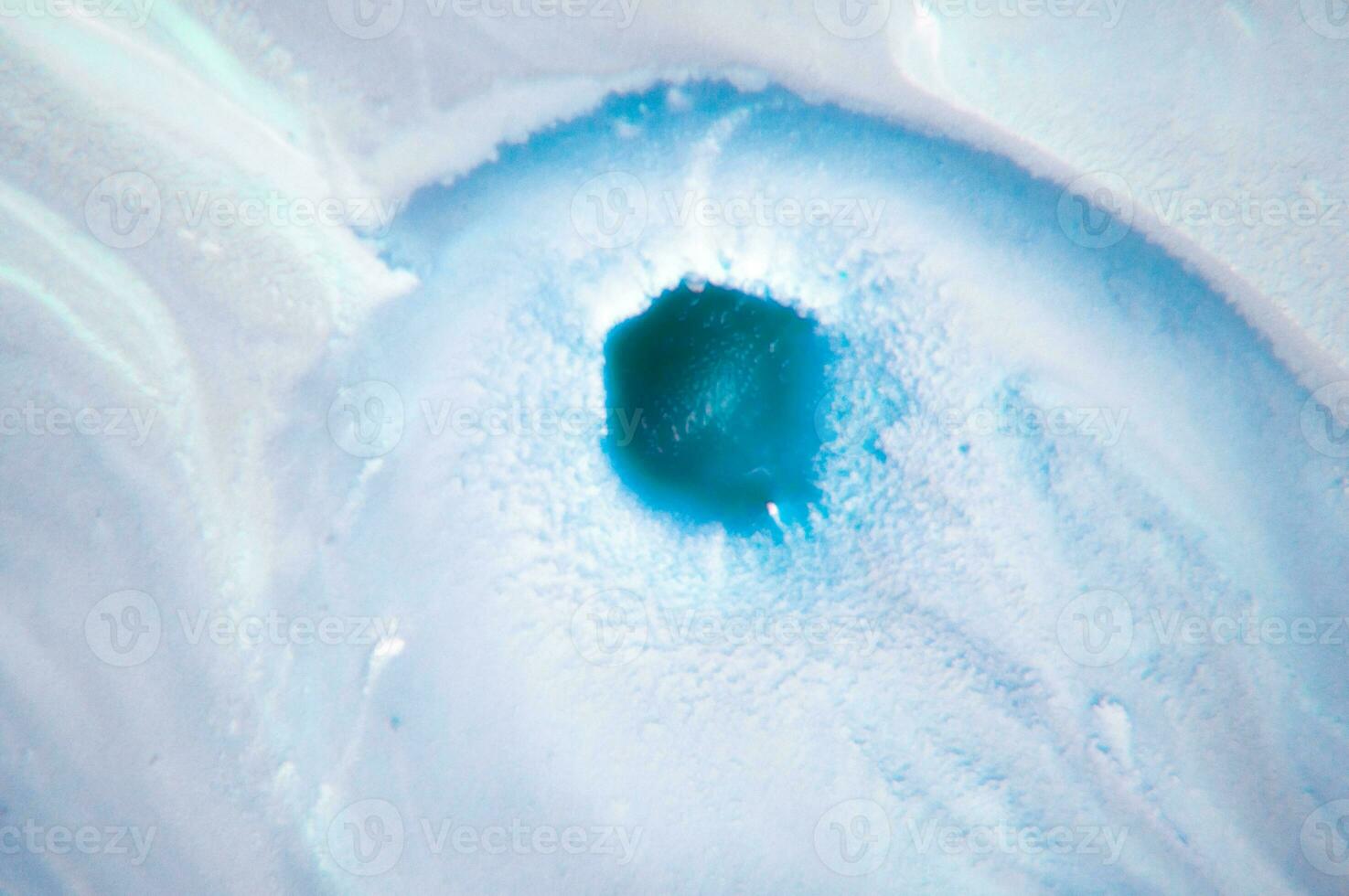 Abstract created using the technique of liquid acrylic. Macro photography of the smallest details of a panting. The panting shows how overflows of shades and colors of paint resemble space motifs. photo