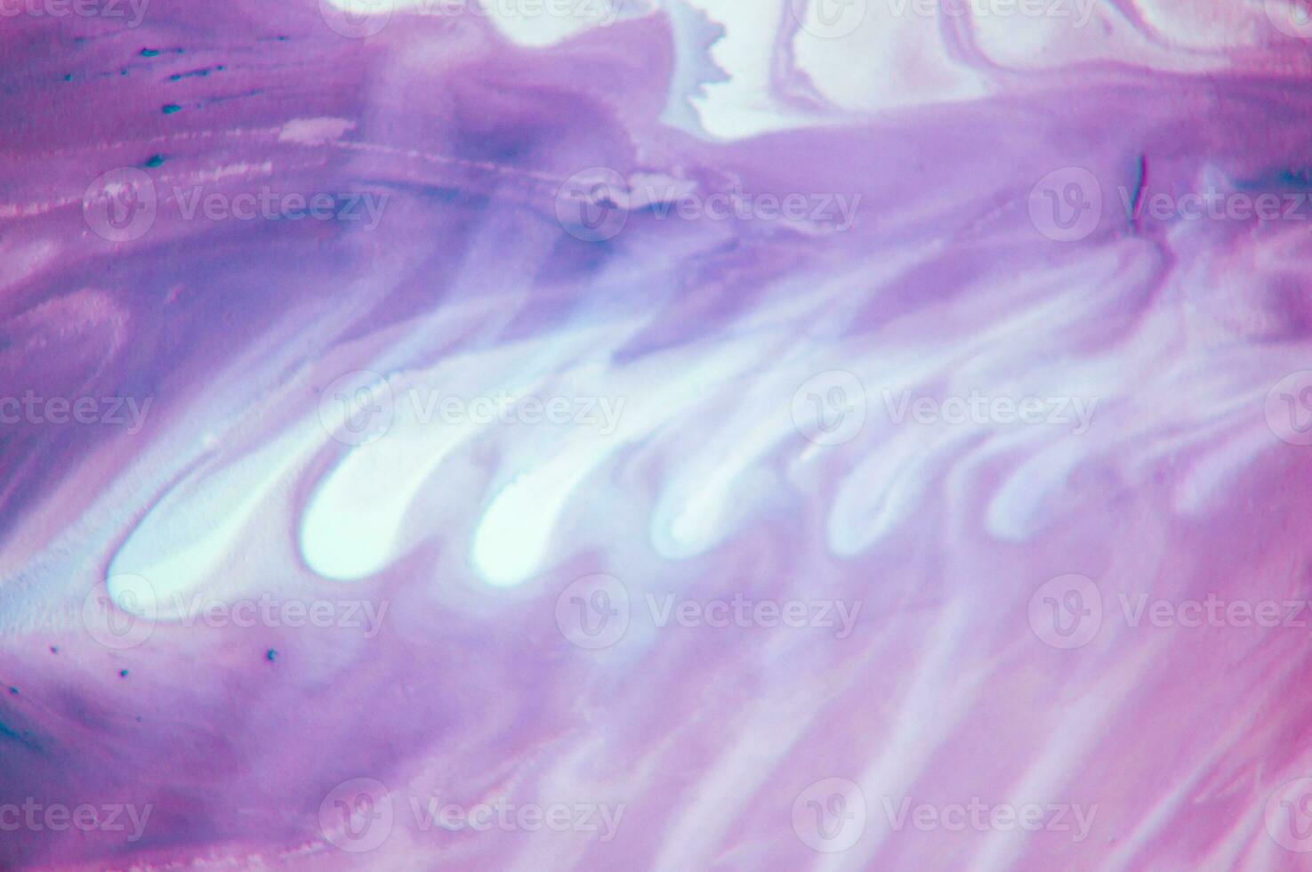 Abstract created using the technique of liquid acrylic. Macro photography of the smallest details of a panting. The panting shows how overflows of shades and colors of paint resemble space motifs. photo