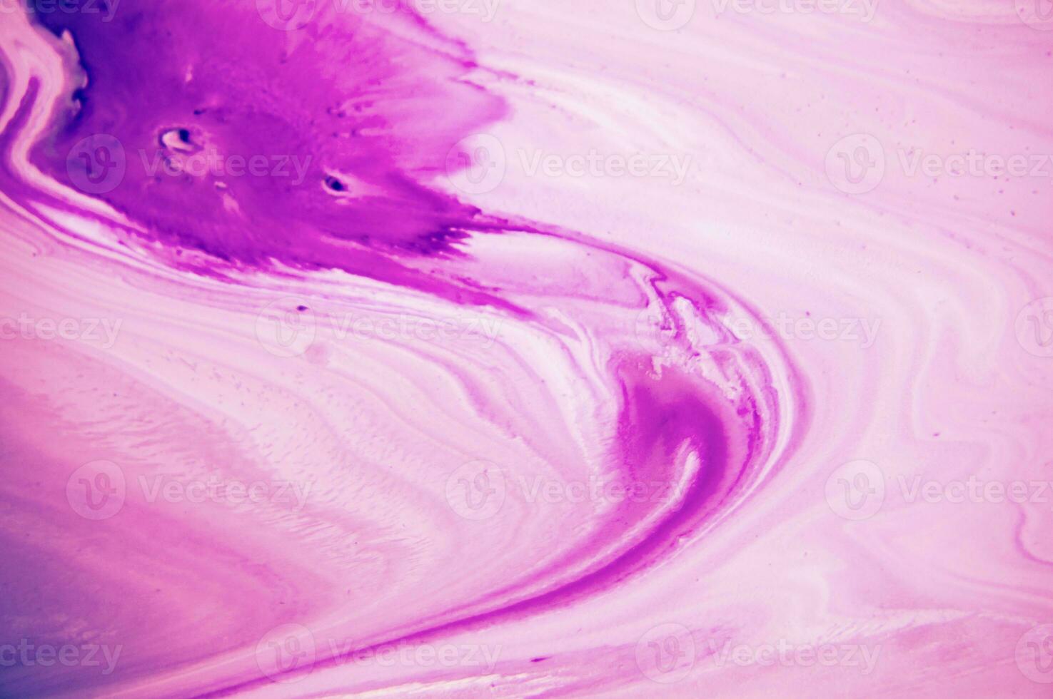 Abstract created using the technique of liquid acrylic. Macro photography of the smallest details of a panting. The panting shows how overflows of shades and colors of paint resemble space motifs. photo