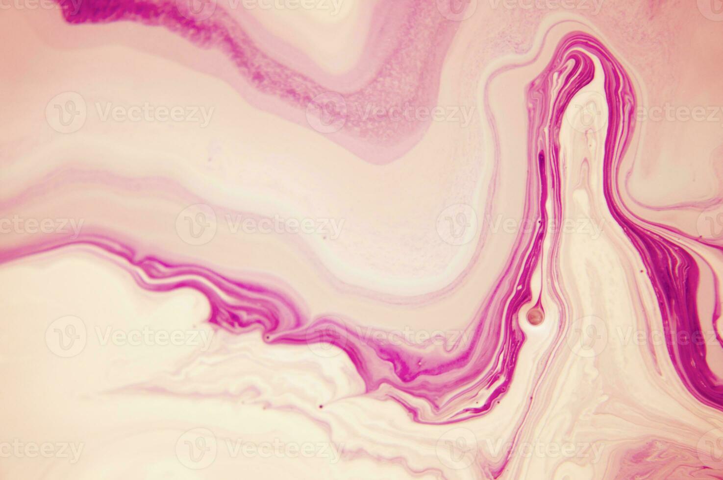 Abstract created using the technique of liquid acrylic. Macro photography of the smallest details of a panting. The panting shows how overflows of shades and colors of paint resemble space motifs. photo