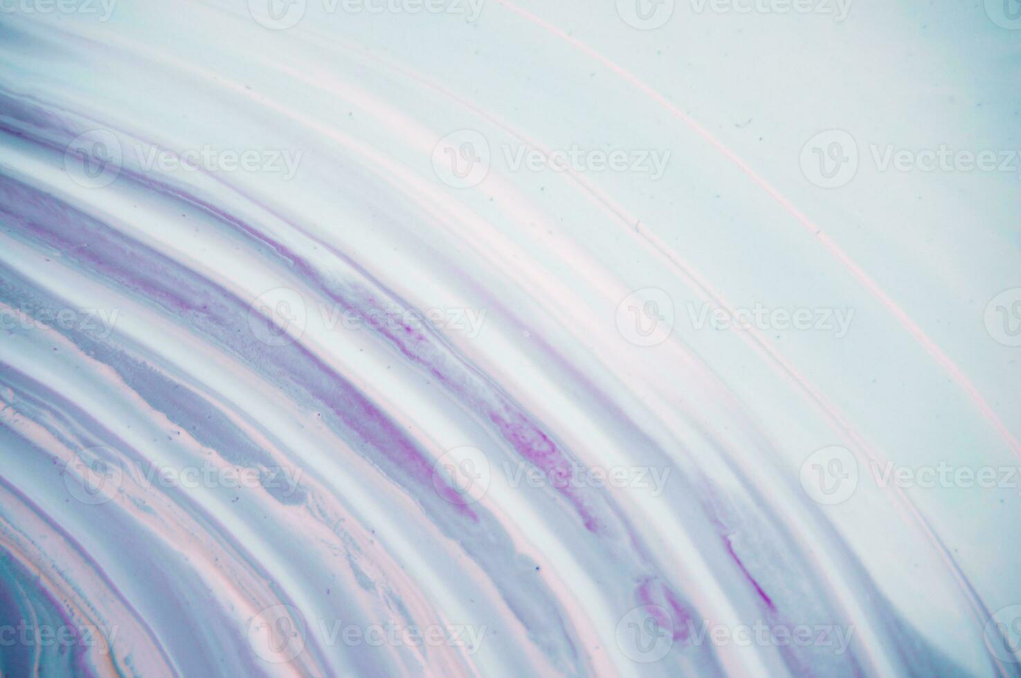Abstract created using the technique of liquid acrylic. Macro photography of the smallest details of a panting. The panting shows how overflows of shades and colors of paint resemble space motifs. photo
