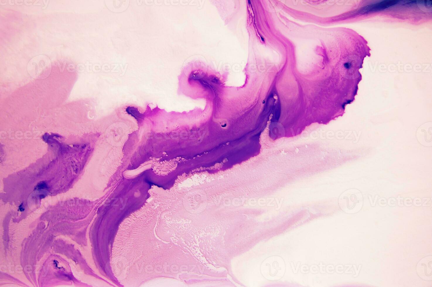 Abstract created using the technique of liquid acrylic. Macro photography of the smallest details of a panting. The panting shows how overflows of shades and colors of paint resemble space motifs. photo