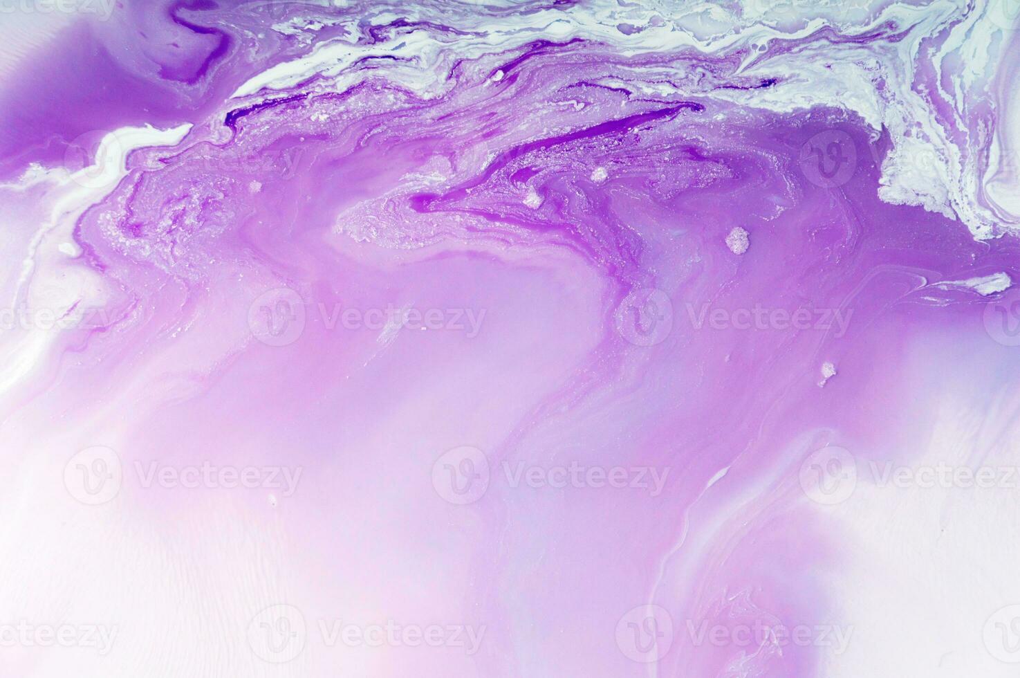 Abstract created using the technique of liquid acrylic. Macro photography of the smallest details of a panting. The panting shows how overflows of shades and colors of paint resemble space motifs. photo
