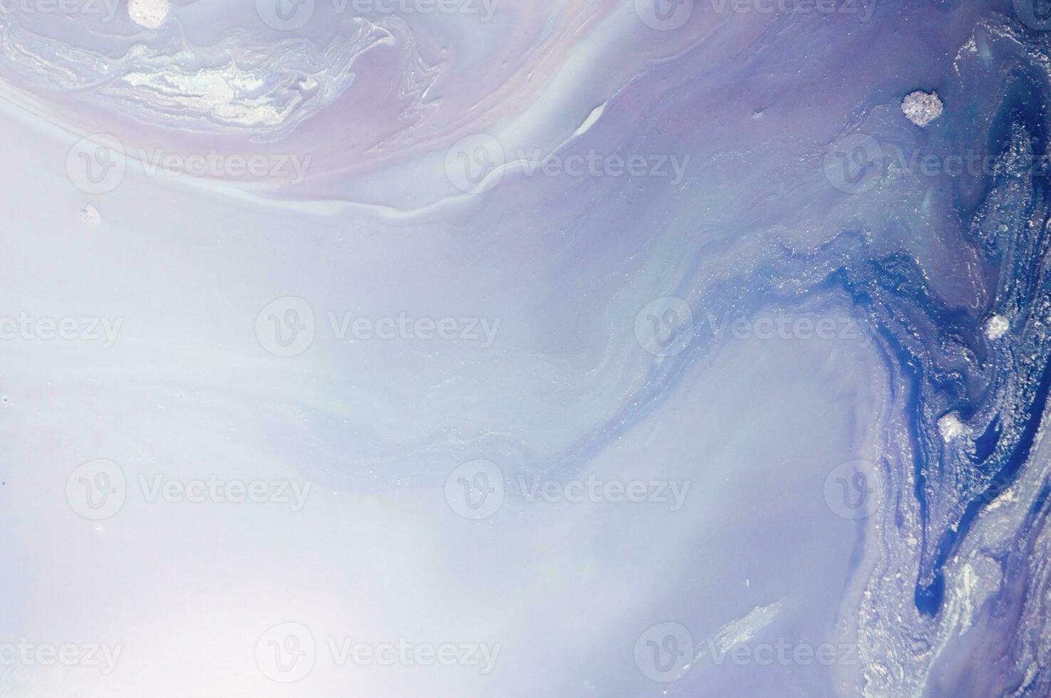 Abstract created using the technique of liquid acrylic. Macro photography of the smallest details of a panting. The panting shows how overflows of shades and colors of paint resemble space motifs. photo