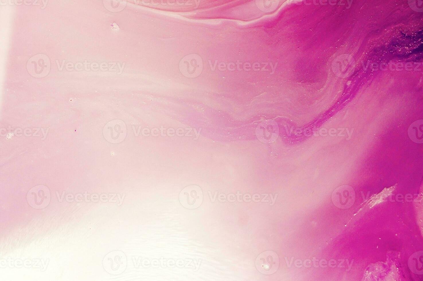 Abstract created using the technique of liquid acrylic. Macro photography of the smallest details of a panting. The panting shows how overflows of shades and colors of paint resemble space motifs. photo