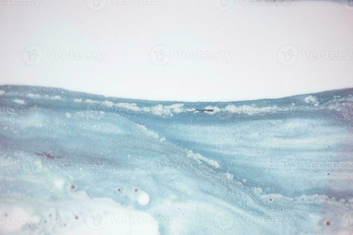 Abstract created using the technique of liquid acrylic. Macro photography of the smallest details of a picture. The picture shows how overflows of shades and colors of paint resemble space motifs. photo