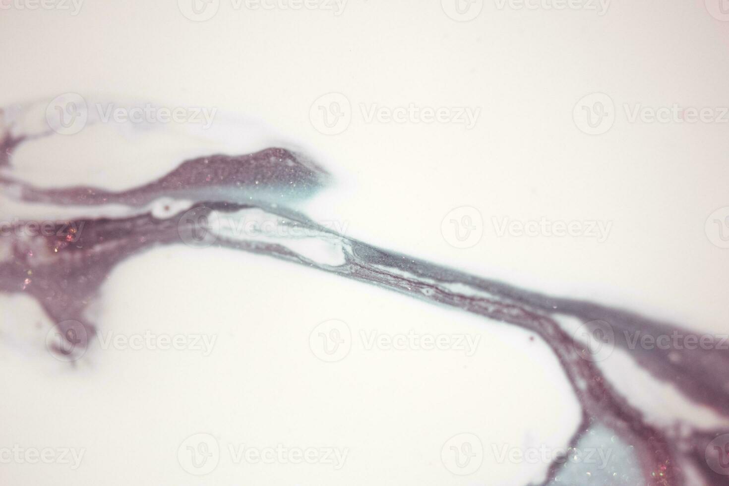 Abstract created using the technique of liquid acrylic. Macro photography of the smallest details of a picture. The picture shows how overflows of shades and colors of paint resemble space motifs. photo