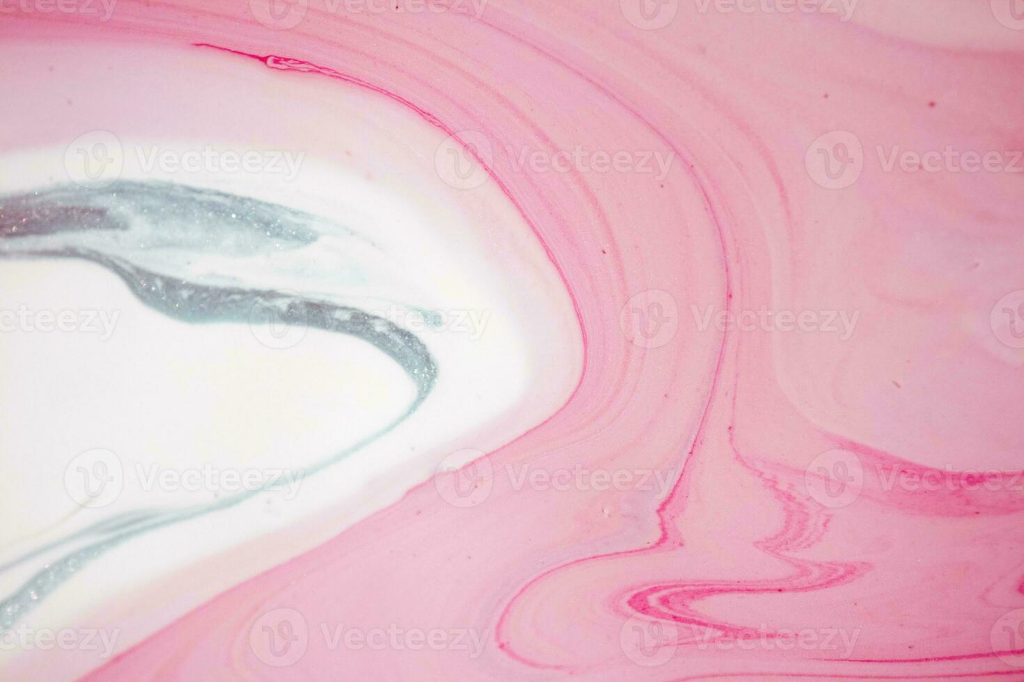 Abstract created using the technique of liquid acrylic. Macro photography of the smallest details of a picture. The picture shows how overflows of shades and colors of paint resemble space motifs. photo