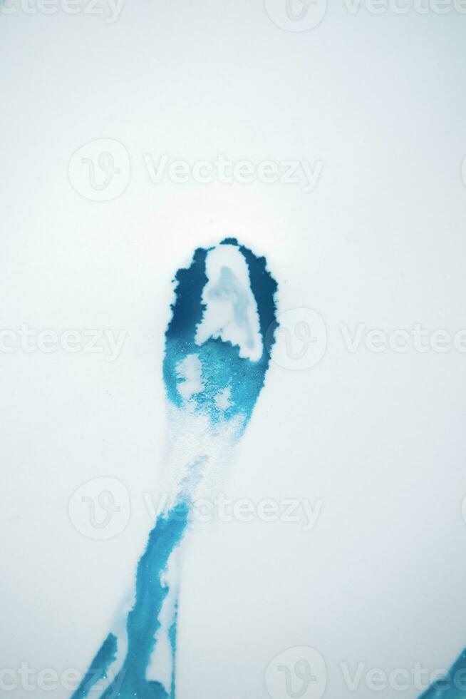 Abstract created using the technique of liquid acrylic. Macro photography of the smallest details of a picture. The picture shows how overflows of shades and colors of paint resemble space motifs. photo