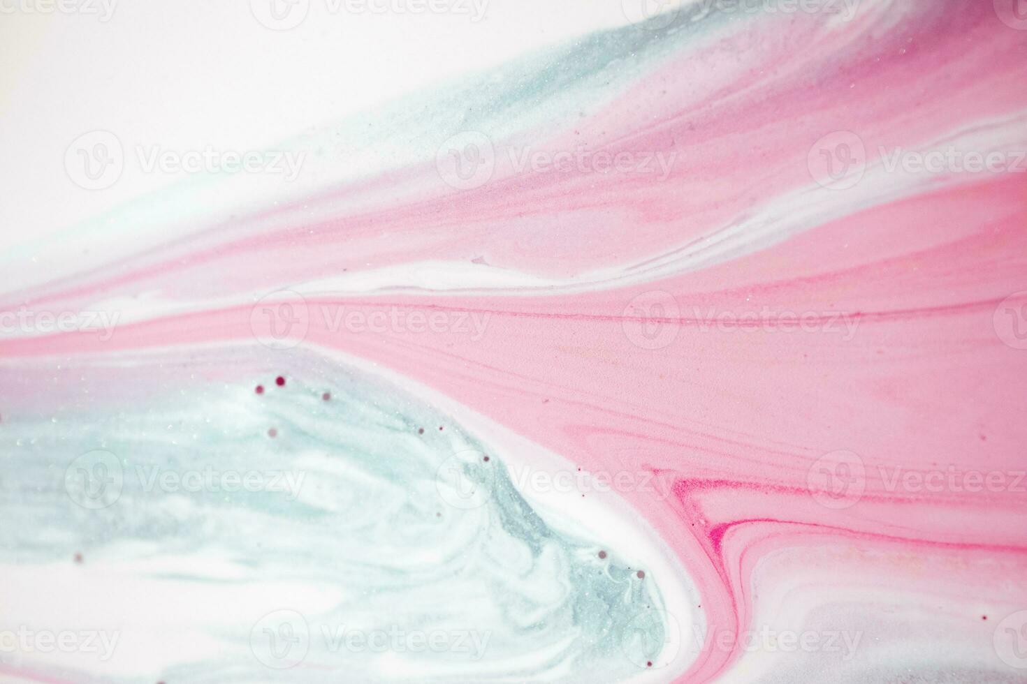 Abstract created using the technique of liquid acrylic. Macro photography of the smallest details of a picture. The picture shows how overflows of shades and colors of paint resemble space motifs. photo