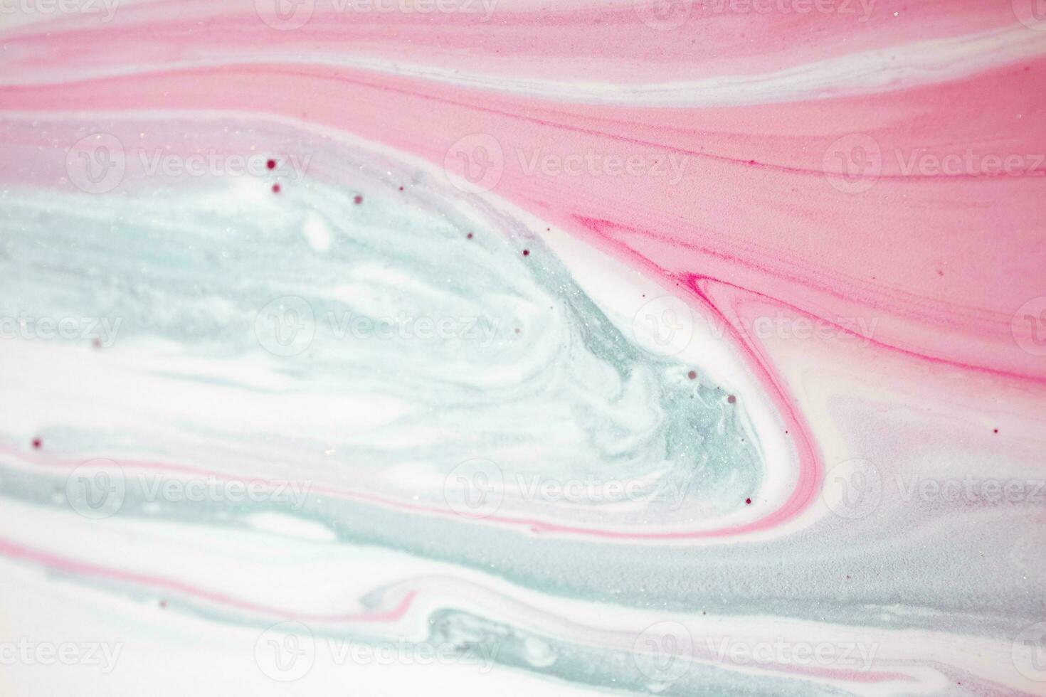 Abstract created using the technique of liquid acrylic. Macro photography of the smallest details of a picture. The picture shows how overflows of shades and colors of paint resemble space motifs. photo