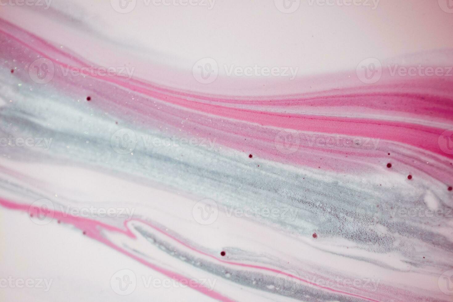 Abstract created using the technique of liquid acrylic. Macro photography of the smallest details of a picture. The picture shows how overflows of shades and colors of paint resemble space motifs. photo