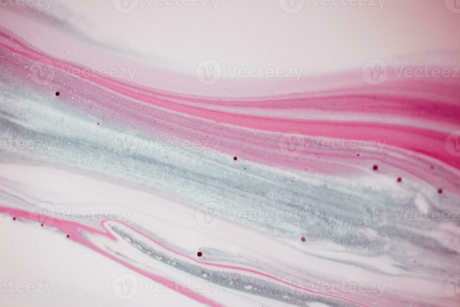 Abstract created using the technique of liquid acrylic. Macro photography of the smallest details of a picture. The picture shows how overflows of shades and colors of paint resemble space motifs. photo