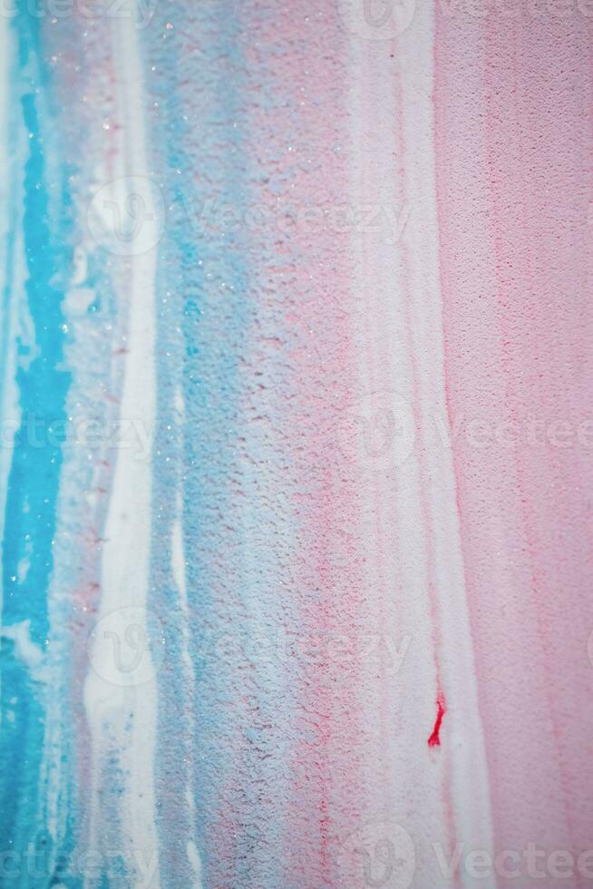 Abstract created using the technique of liquid acrylic. Macro photography of the smallest details of a picture. The picture shows how overflows of shades and colors of paint resemble space motifs. photo