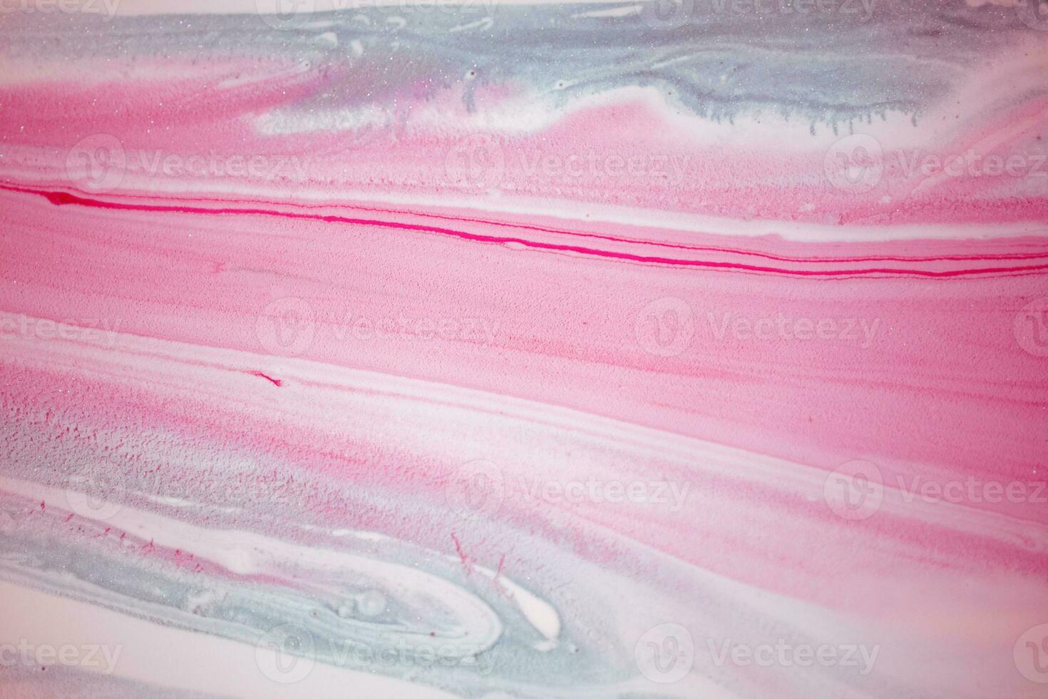 Abstract created using the technique of liquid acrylic. Macro photography of the smallest details of a picture. The picture shows how overflows of shades and colors of paint resemble space motifs. photo
