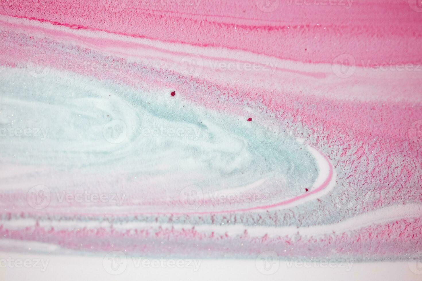 Abstract created using the technique of liquid acrylic. Macro photography of the smallest details of a picture. The picture shows how overflows of shades and colors of paint resemble space motifs. photo