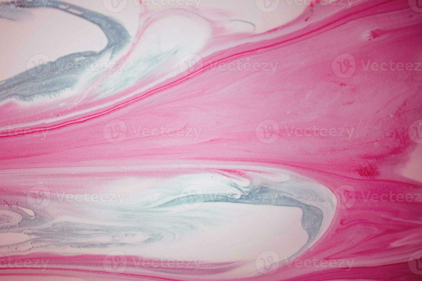 Abstract created using the technique of liquid acrylic. Macro photography of the smallest details of a picture. The picture shows how overflows of shades and colors of paint resemble space motifs. photo