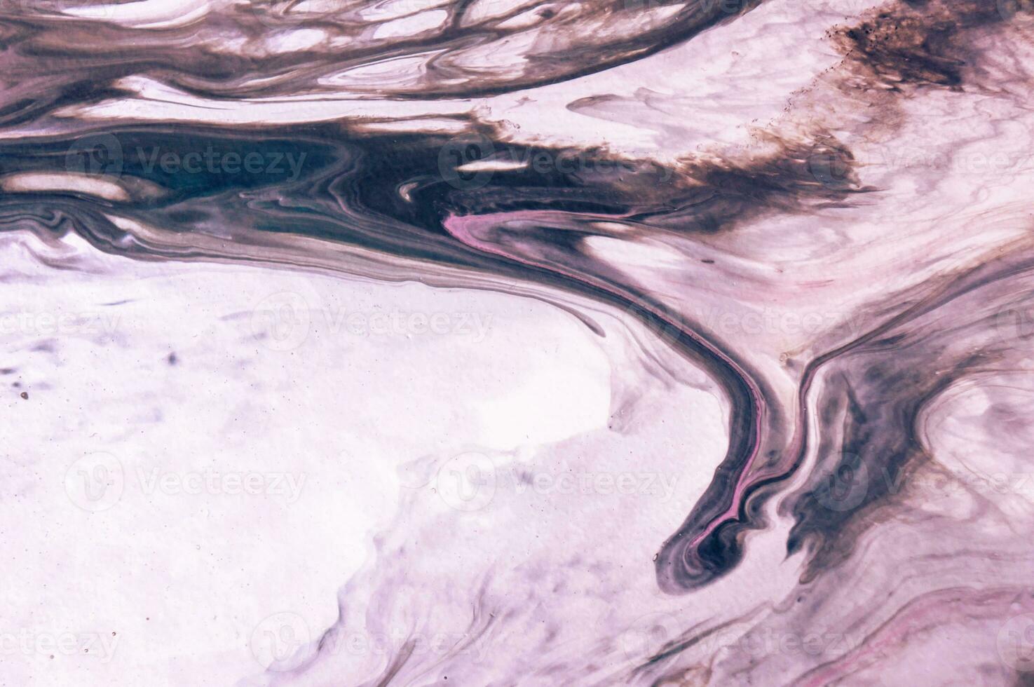 Abstract created using the technique of liquid acrylic. Macro photography of the smallest details of a picture. The picture shows how overflows of shades and colors of paint resemble space motifs. photo