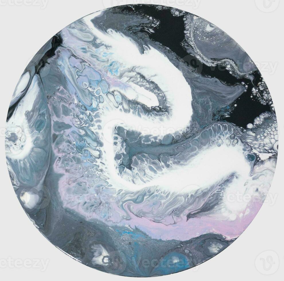 Abstract created using the technique of liquid acrylic. Macro photography of the smallest details of a picture. The picture shows how overflows of shades and colors of paint resemble space motifs. photo