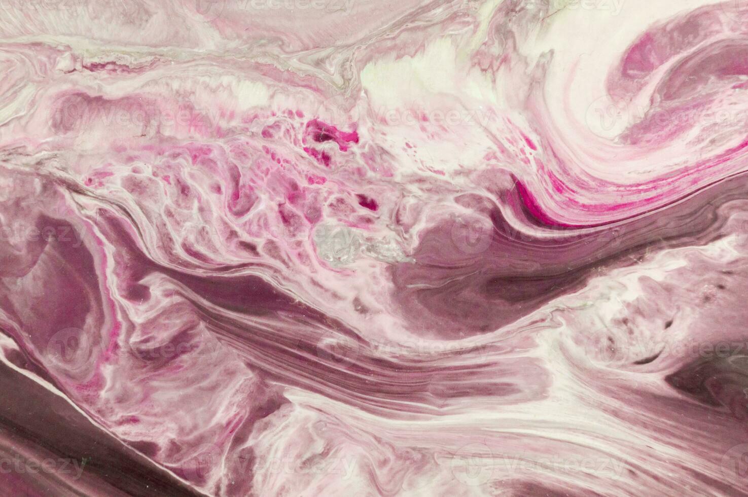 Abstract created using the technique of liquid acrylic. Macro photography of the smallest details of a picture. The picture shows how overflows of shades and colors of paint resemble space motifs. photo
