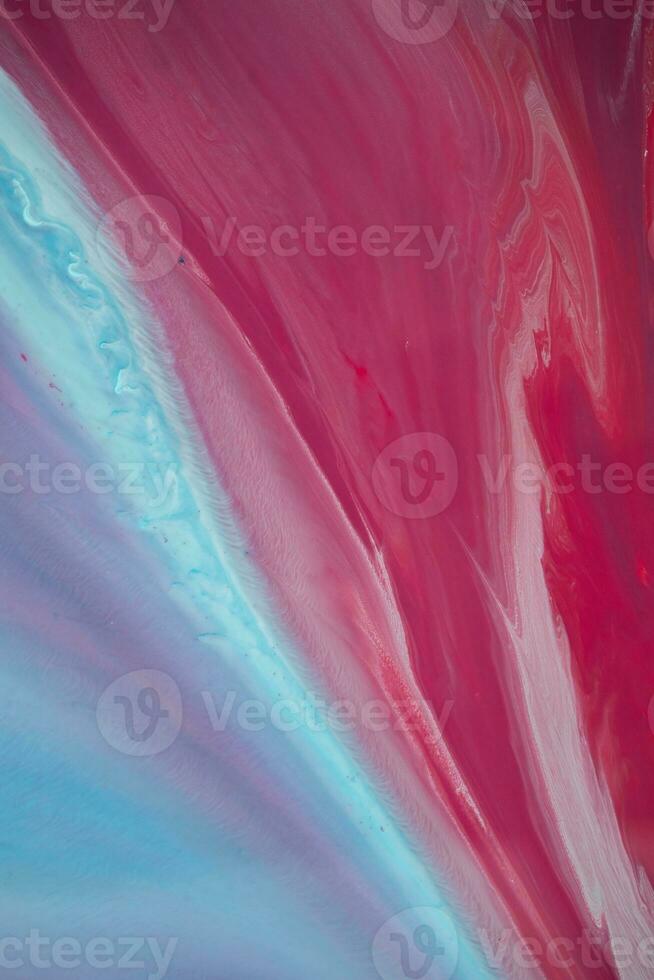 Abstract created using the technique of liquid acrylic. Macro photography of the smallest details of a panting. The panting shows how overflows of shades and colors of paint resemble space motifs. photo