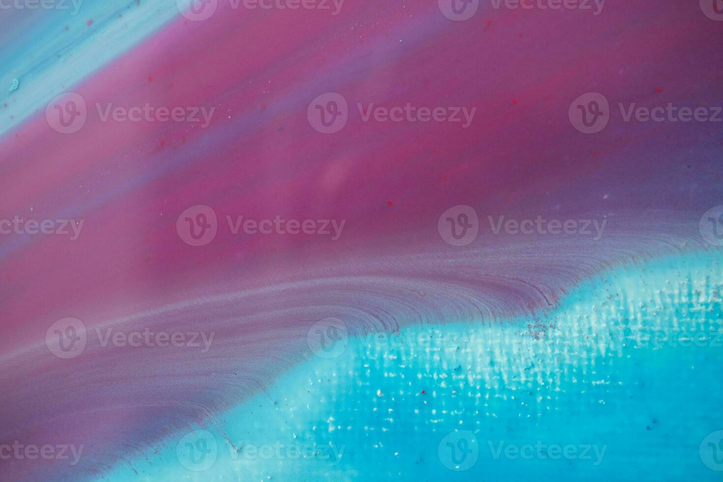 Abstract created using the technique of liquid acrylic. Macro photography of the smallest details of a panting. The panting shows how overflows of shades and colors of paint resemble space motifs. photo