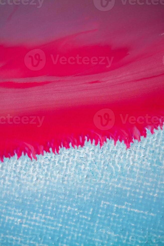 Abstract created using the technique of liquid acrylic. Macro photography of the smallest details of a panting. The panting shows how overflows of shades and colors of paint resemble space motifs. photo