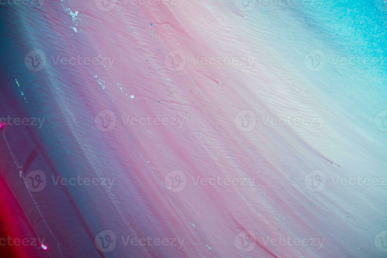 Abstract created using the technique of liquid acrylic. Macro photography of the smallest details of a panting. The panting shows how overflows of shades and colors of paint resemble space motifs. photo