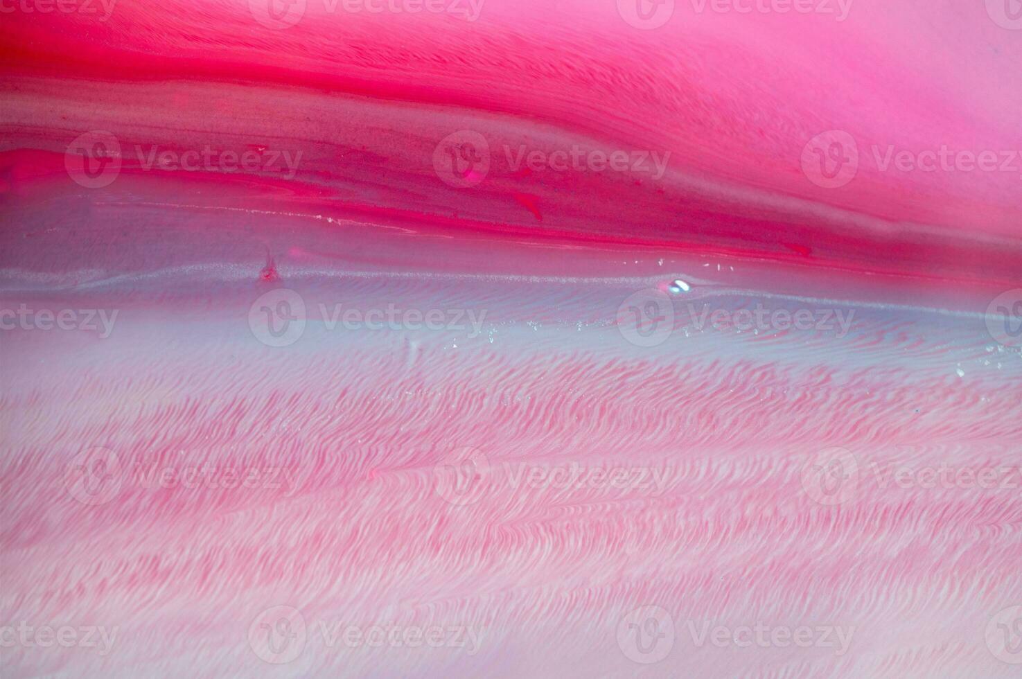 Abstract created using the technique of liquid acrylic. Macro photography of the smallest details of a panting. The panting shows how overflows of shades and colors of paint resemble space motifs. photo