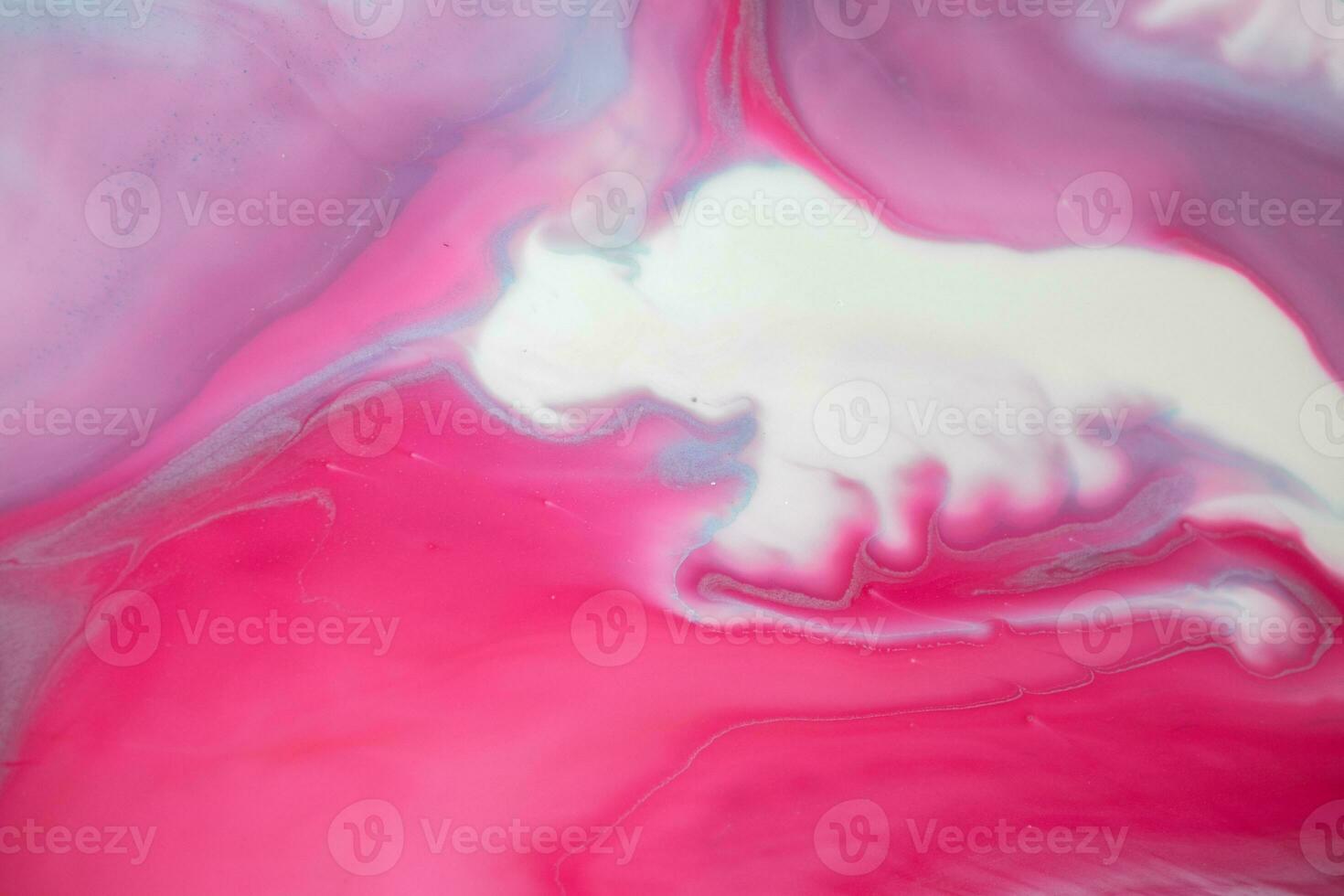 Abstract created using the technique of liquid acrylic. Macro photography of the smallest details of a panting. The panting shows how overflows of shades and colors of paint resemble space motifs. photo