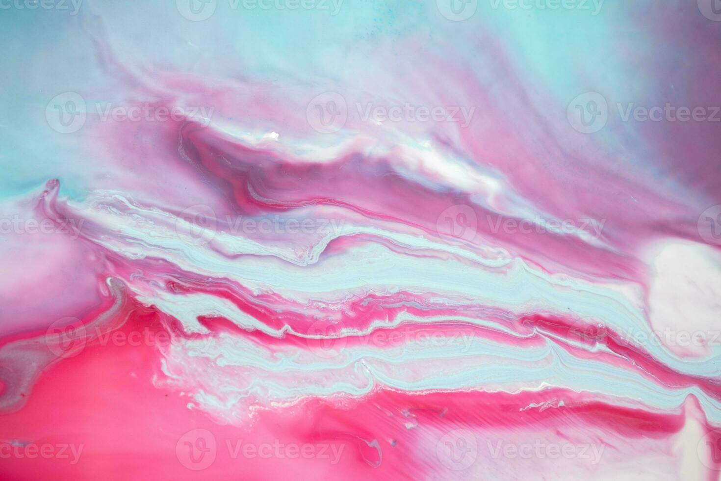 Abstract created using the technique of liquid acrylic. Macro photography of the smallest details of a panting. The panting shows how overflows of shades and colors of paint resemble space motifs. photo