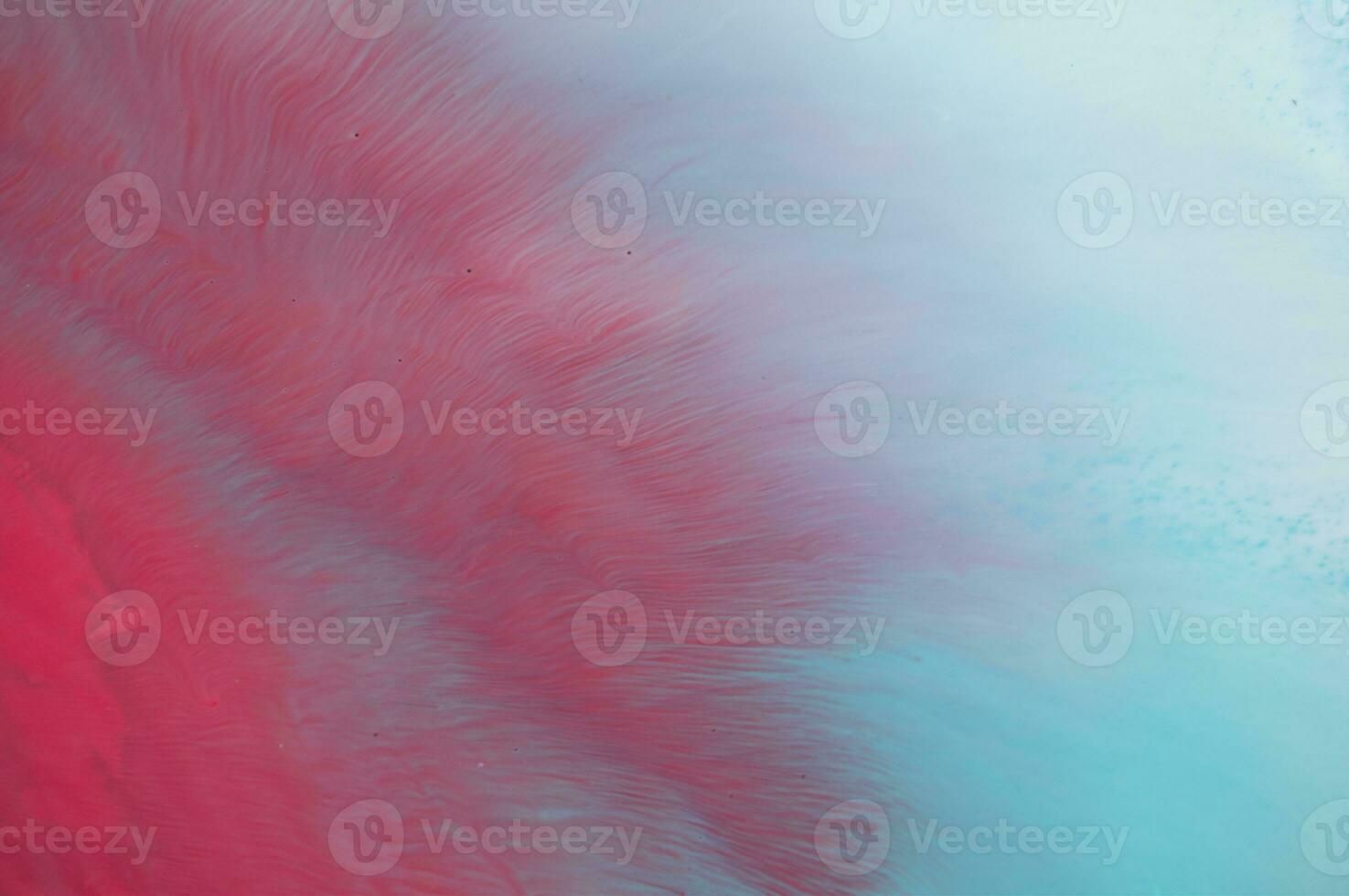Abstract created using the technique of liquid acrylic. Macro photography of the smallest details of a panting. The panting shows how overflows of shades and colors of paint resemble space motifs. photo