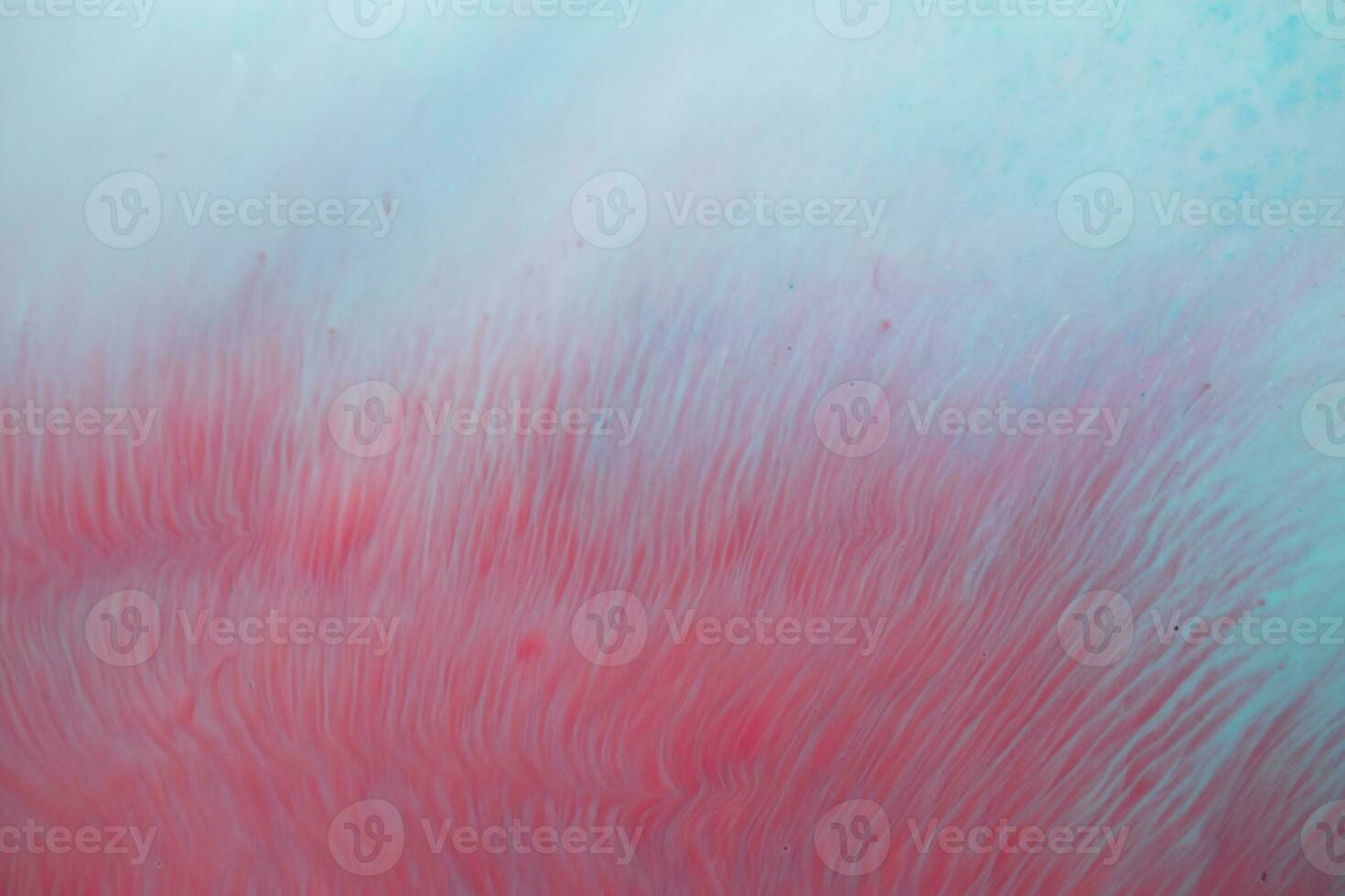 Abstract created using the technique of liquid acrylic. Macro photography of the smallest details of a panting. The panting shows how overflows of shades and colors of paint resemble space motifs. photo