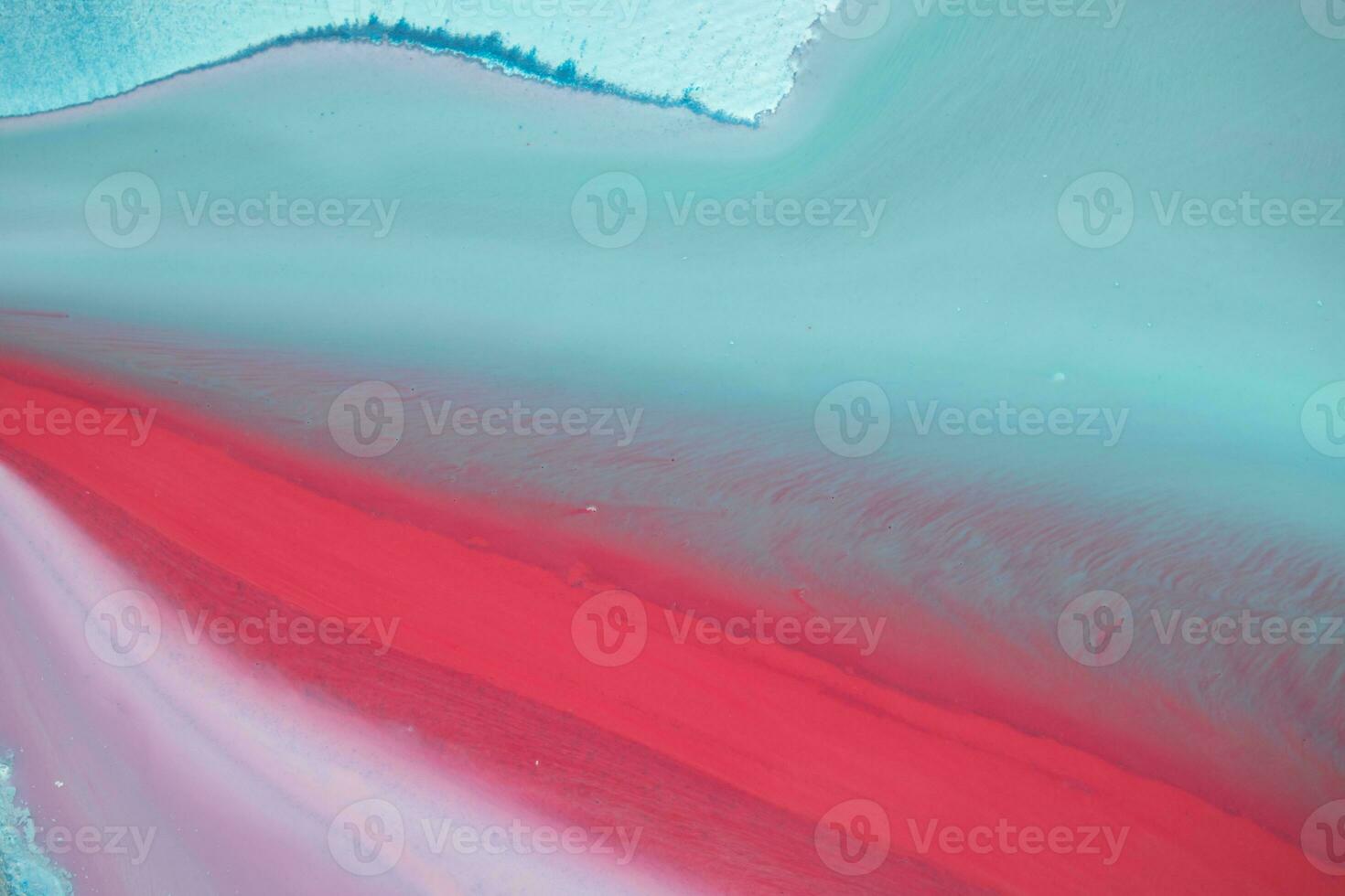 Abstract created using the technique of liquid acrylic. Macro photography of the smallest details of a panting. The panting shows how overflows of shades and colors of paint resemble space motifs. photo