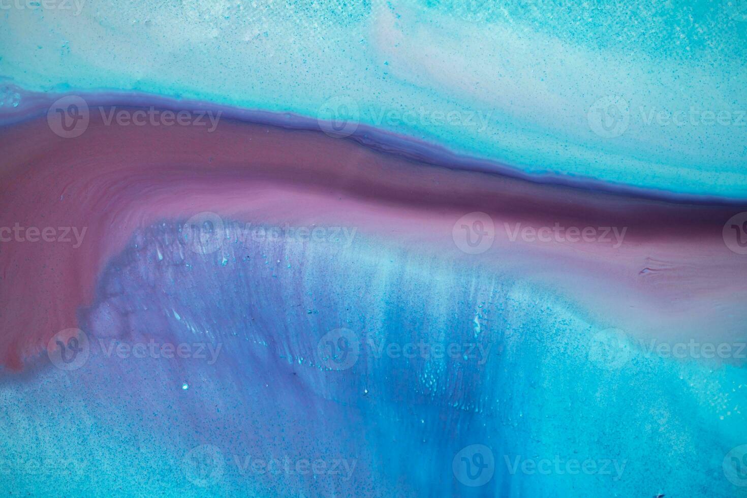 Abstract created using the technique of liquid acrylic. Macro photography of the smallest details of a panting. The panting shows how overflows of shades and colors of paint resemble space motifs. photo