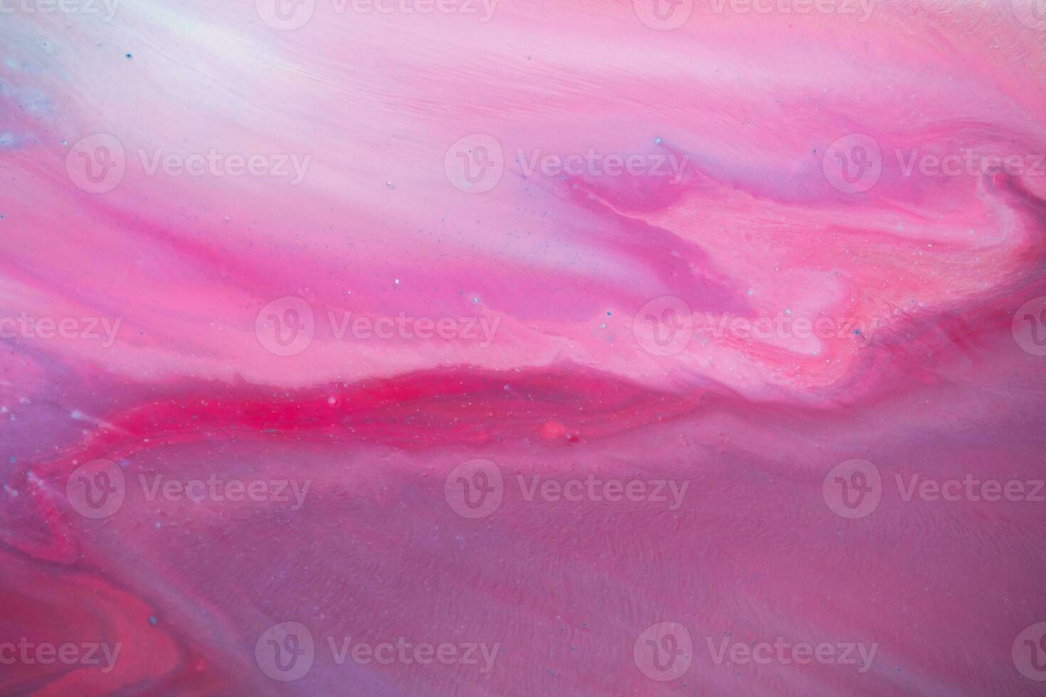 Abstract created using the technique of liquid acrylic. Macro photography of the smallest details of a panting. The panting shows how overflows of shades and colors of paint resemble space motifs. photo