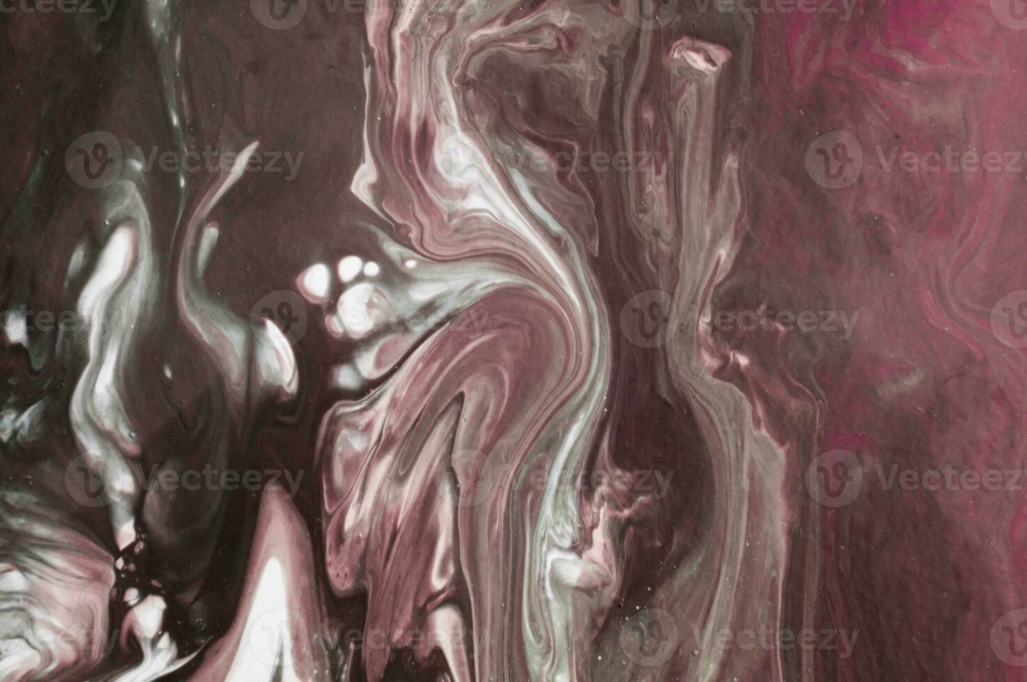 Abstract created using the technique of liquid acrylic. Macro photography of the smallest details of a picture. The picture shows how overflows of shades and colors of paint resemble space motifs. photo