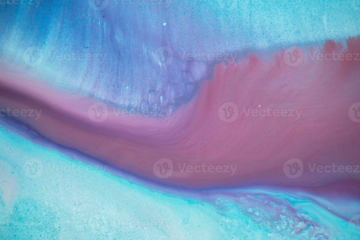 Abstract created using the technique of liquid acrylic. Macro photography of the smallest details of a panting. The panting shows how overflows of shades and colors of paint resemble space motifs. photo
