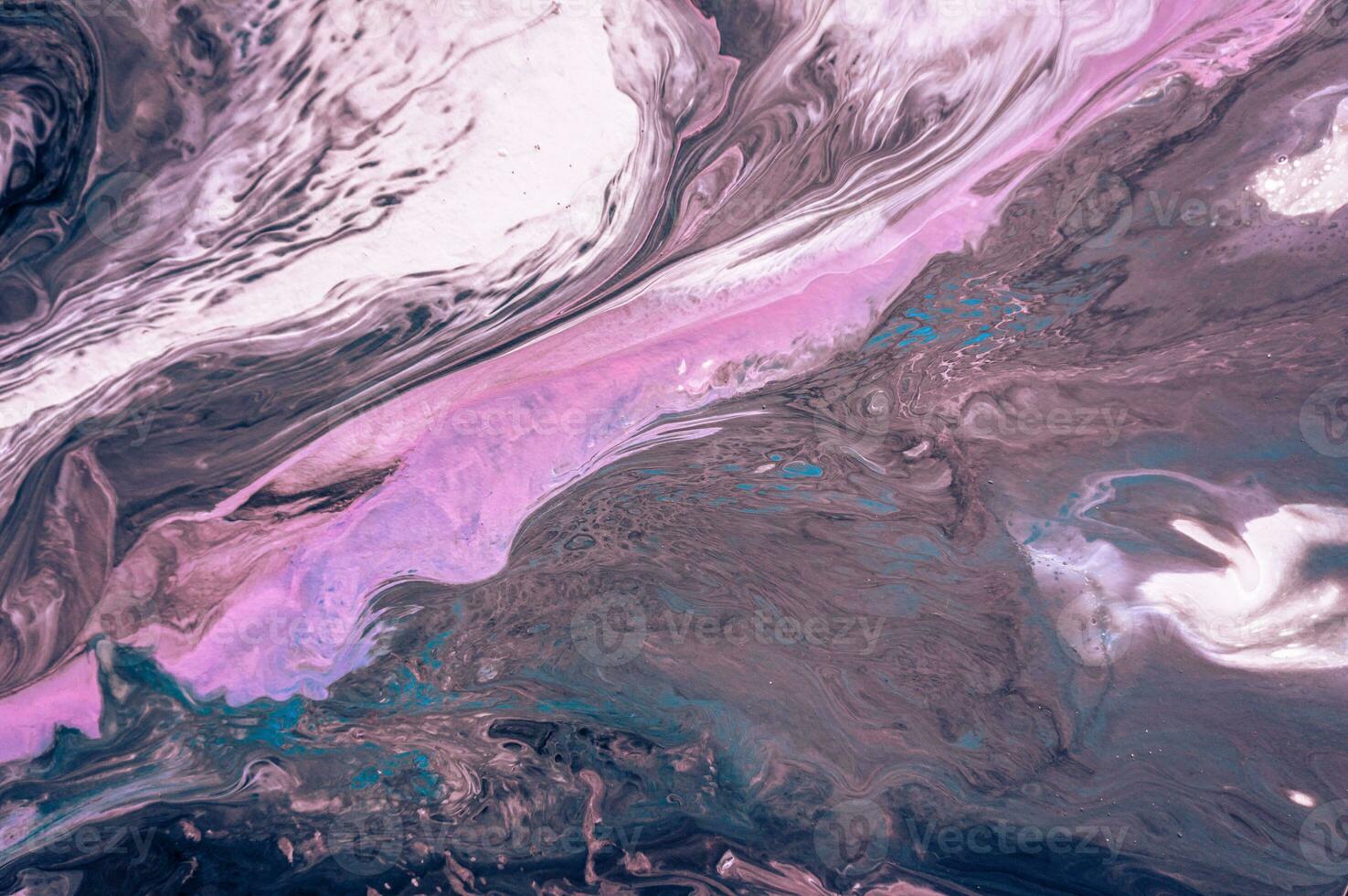 Abstract created using the technique of liquid acrylic. Macro photography of the smallest details of a picture. The picture shows how overflows of shades and colors of paint resemble space motifs. photo