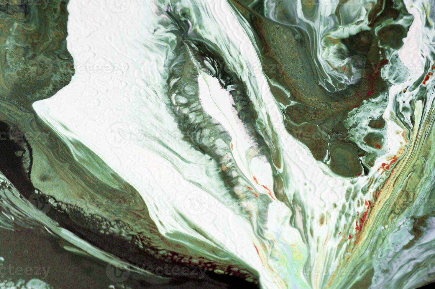 Abstract created using the technique of liquid acrylic. Macro photography of the smallest details of a picture. The picture shows how overflows of shades and colors of paint resemble space motifs. photo