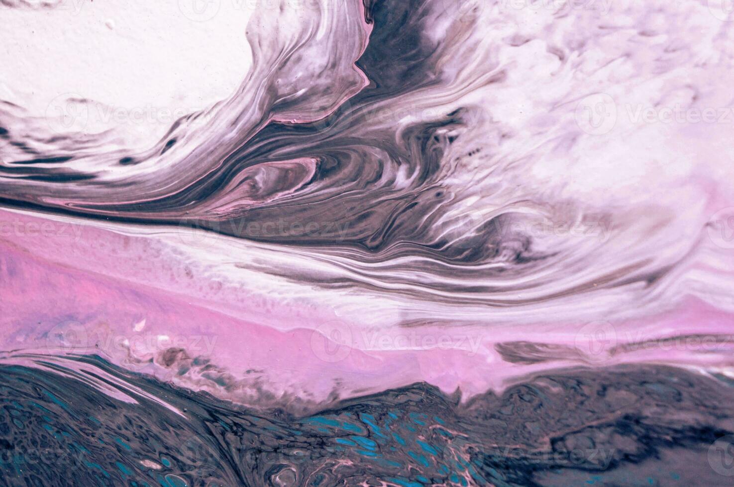 Abstract created using the technique of liquid acrylic. Macro photography of the smallest details of a picture. The picture shows how overflows of shades and colors of paint resemble space motifs. photo