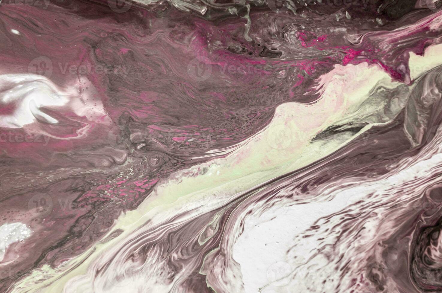 Abstract created using the technique of liquid acrylic. Macro photography of the smallest details of a picture. The picture shows how overflows of shades and colors of paint resemble space motifs. photo