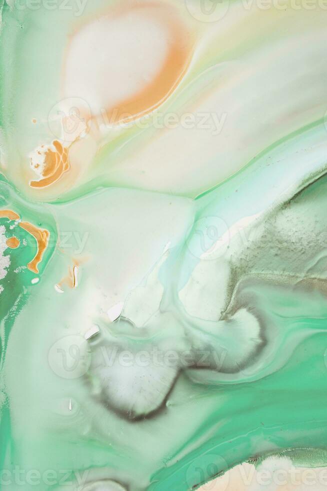 Abstract created using the technique of liquid acrylic. Macro photography of the smallest details of a picture. The picture shows how overflows of shades and colors of paint resemble space motifs. photo