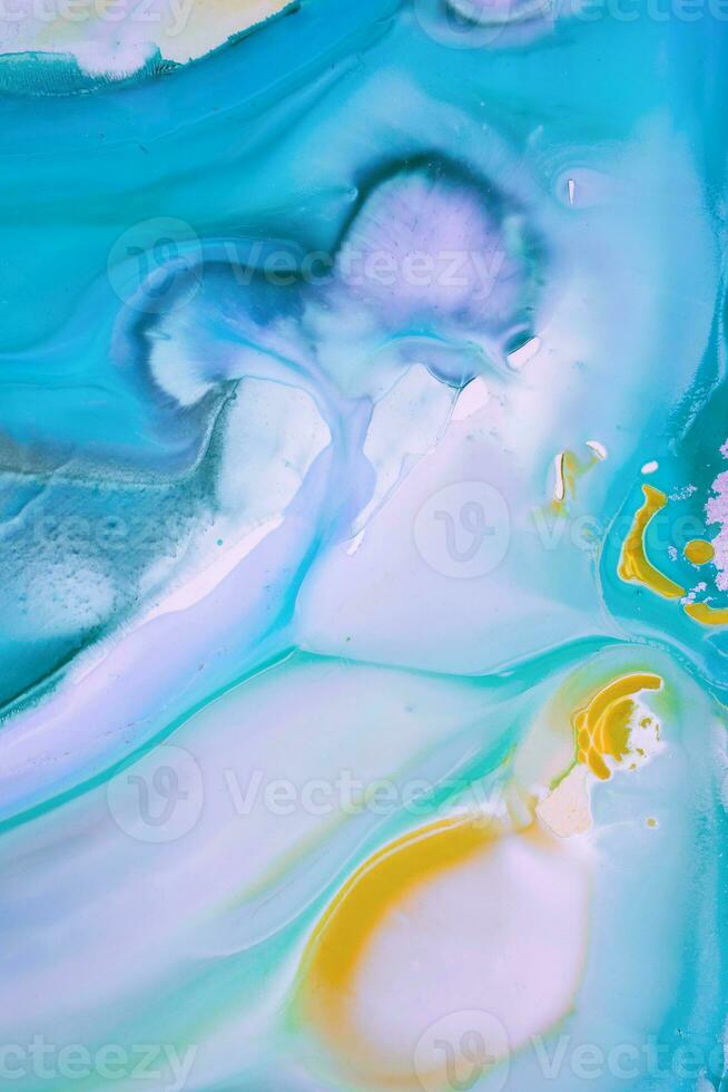 Abstract created using the technique of liquid acrylic. Macro photography of the smallest details of a picture. The picture shows how overflows of shades and colors of paint resemble space motifs. photo